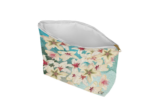 Floral patterned pouch on a aqua background