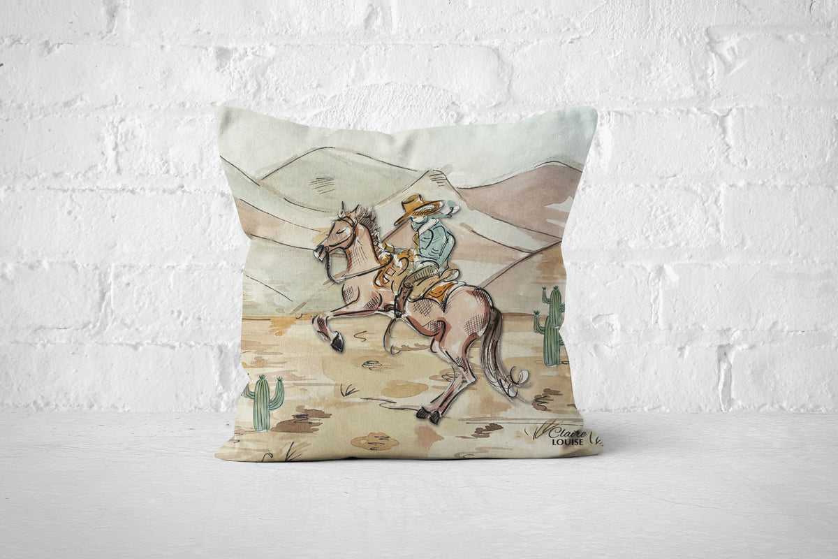 A square throw pillow featuring a western-themed illustration of a cowboy riding a galloping horse, set against a white brick wall background.