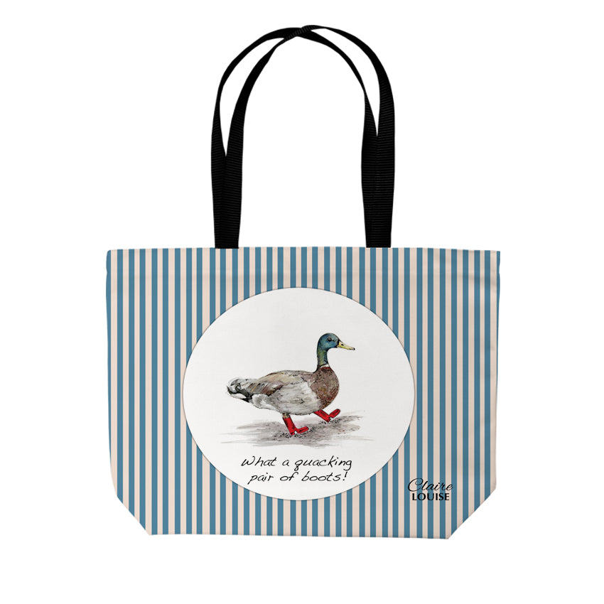 Tote bag with duck illustration and text on a stripe background