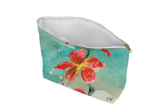 Floral patterned pouch on a green background
