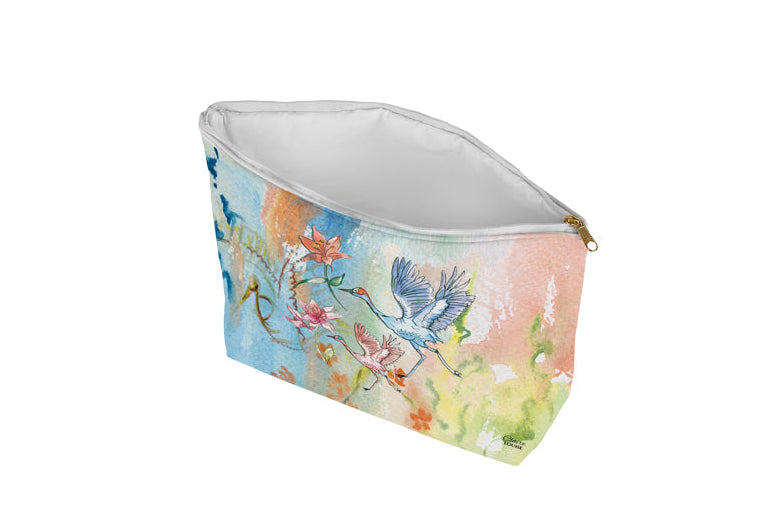 Cosmetic bag with floral and bird design on a white background