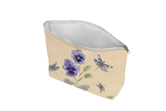 Cosmetic bag with floral and dragonfly design on a beige background