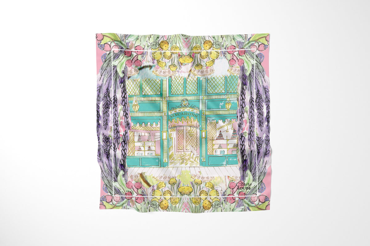 Ladurée In Full Bloom Scarf by Claire Louise: watercolour of the mint green Ladurée macaron shopfront framed by lavender, pink berries and yellow blooms
